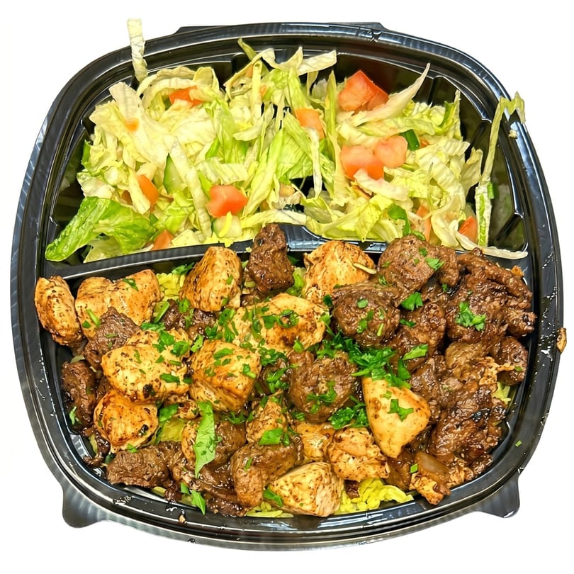 A black takeout container with chicken and beef over rice, and a side salad.