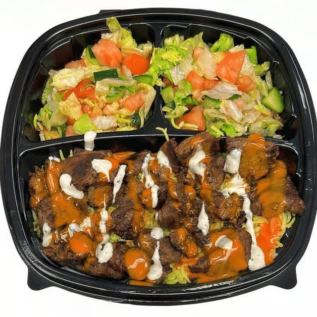 Grilled Lamb on Rice with Salad & Buffalo + Ranch Sauce on the top.